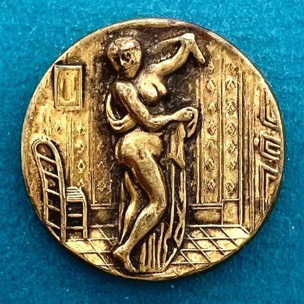 “After the bath” brass button of woman.