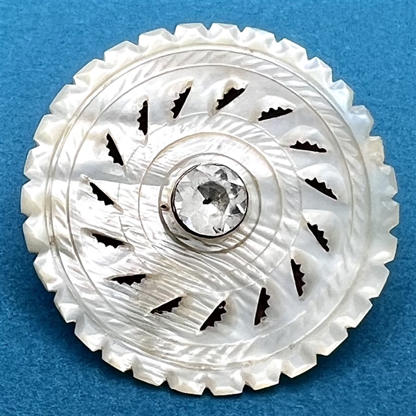 An 18th c. Carved pearl button with paste center. 