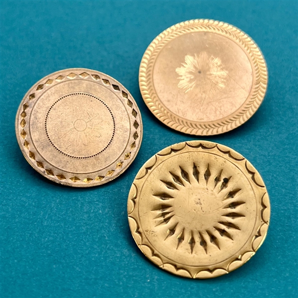 Three 18th c. chased copper Colonial buttons.