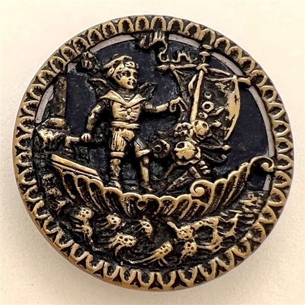 Brass button of a boy in sailboat.