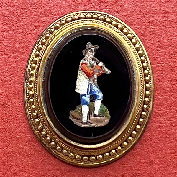 Unique Italian micro mosaic button of a man playing a musical instrument.