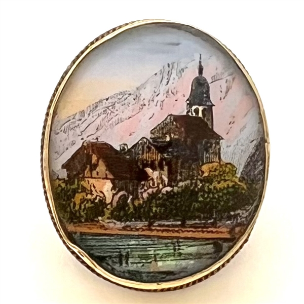 Reverse-painted architectural scene under glass set in gilded metal button.