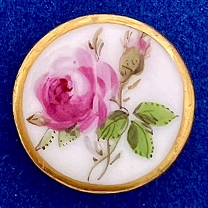 An 18th c. Dresden porcelain button of a rose.