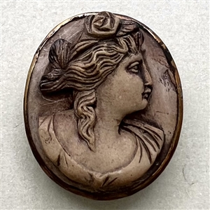 Lava cameo button of a woman’s profile.