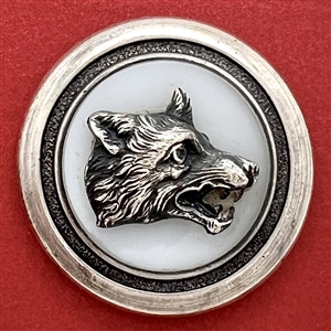 Clambroth glass set in metal with wolf head escutcheon sporting button.