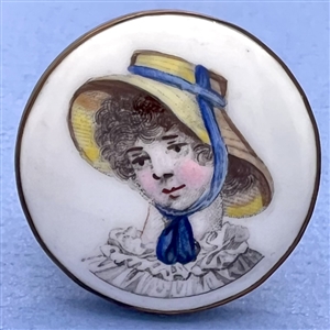 Porcelain button of a girl in straw hat with blue ribbon.