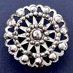 An 18th c. Pierced steel button with polished faceted steels.