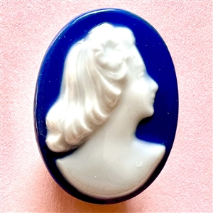 Limoges porcelain oval button of a woman’s head.