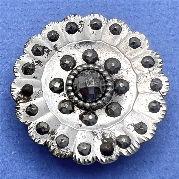 An 18th c. Scalloped steel button.