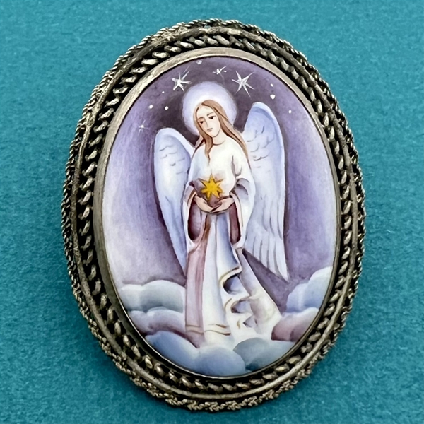 Enamel button of an angel set in silver (?).