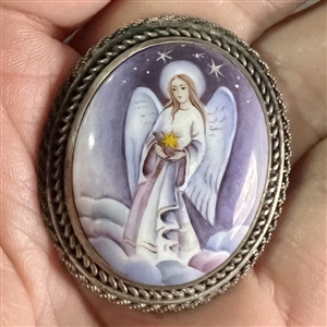 Enamel button of an angel set in silver (?).