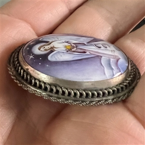 Enamel button of an angel set in silver (?).