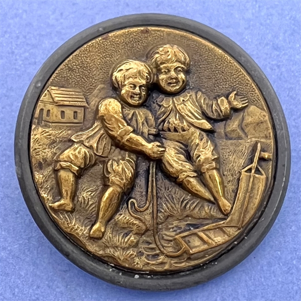 “Boating" brass button of two boys playing with sailboat.