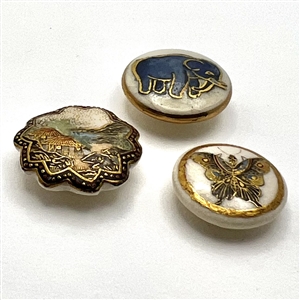 Three sweet little Satsuma buttons.