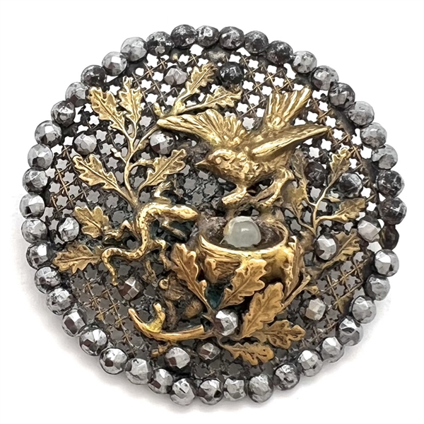 A 19th c. screen back button of bird defending nest with egg from a lizard!
