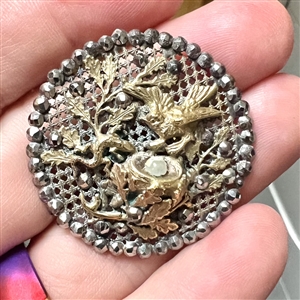 A 19th c. screen back button of bird defending nest with egg from a lizard!