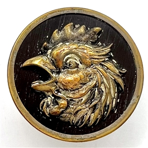 French brass button of a rooster with imitation wood background.