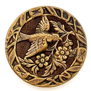 Brass button of a “Dove of peace" with velvet background.