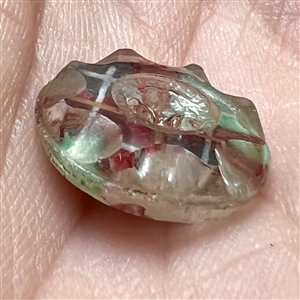 Scarce paperback faceted glass sew-thru button.