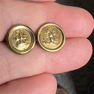 Two Jacksonian gilt brass waistcoat buttons.