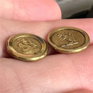 Two Jacksonian gilt brass waistcoat buttons.