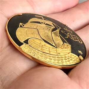 Damascene sailing ship button with verbal.