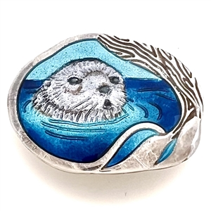 Studio enamel and silver button of an otter.