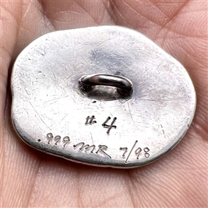 Studio enamel and silver button of an otter.