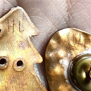 Two studio enamel buttons by Herman Lowenstein.