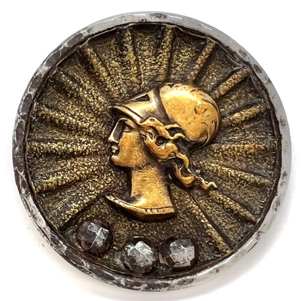 Steel cup button of a Greek womans head.