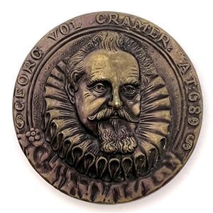 “George Vol Cramer" Stamped and tinted brass button copied from a coin. 