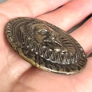 “George Vol Cramer Stamped and tinted brass button copied from a coin. 