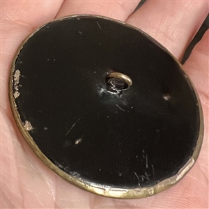 “George Vol Cramer Stamped and tinted brass button copied from a coin. 