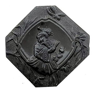 Modified square black glass button of Madame Chrysanthemum. 