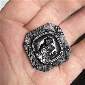 Modified square black glass button of Madame Chrysanthemum. 