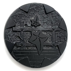 “Ivy leaves and trellis" black glass button.