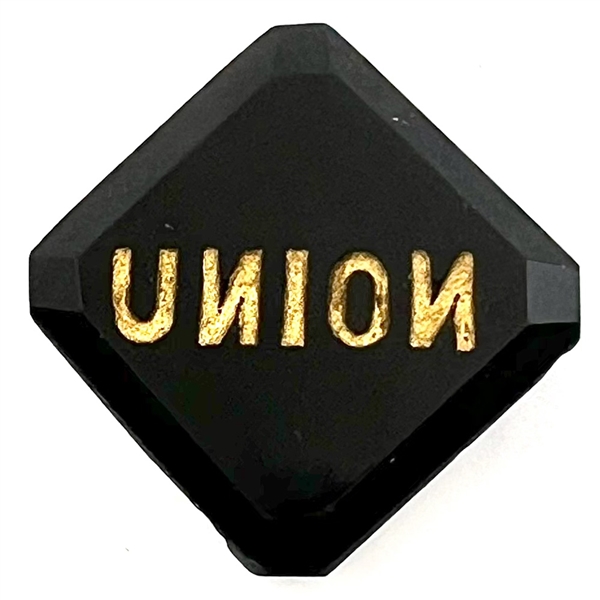 Modified square black glass verbal button of the word “Union" with the Ns reversed.