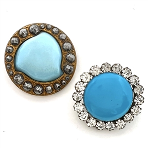Two blue glass in metal buttons.