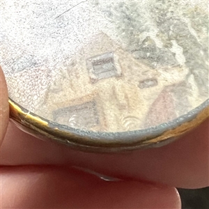 An 18th c. Painting of a village scene button.