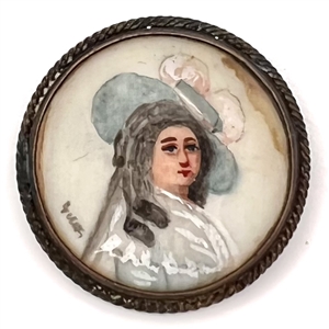 Painting on natural material button of woman in blue hat.