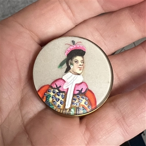 Painting on silk fabric button of an Asian man.