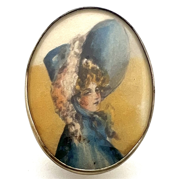 HUGE oval painting of a woman in huge hat set in silver button.
