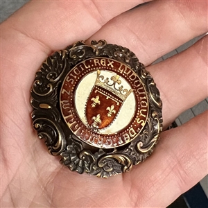Large brass button with enamel center of verbal around French shield and crown.