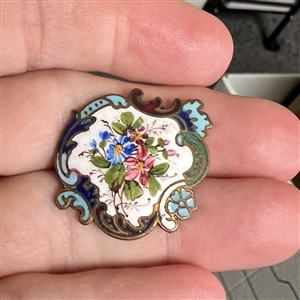 Enamel button of flowers with unusual Rococo border.