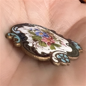 Enamel button of flowers with unusual Rococo border.
