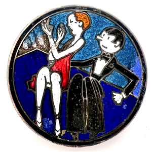 A champlevé enamel button of a 1920s man and woman out on the town.