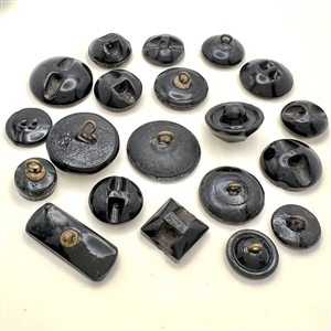 Twenty black glass buttons.