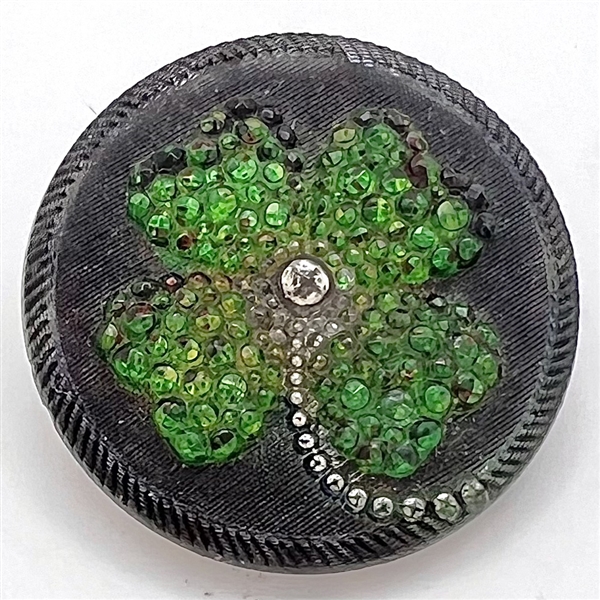 Lacy glass glass shamrock button.