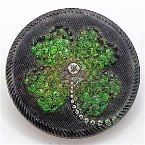 Lacy glass glass shamrock button.