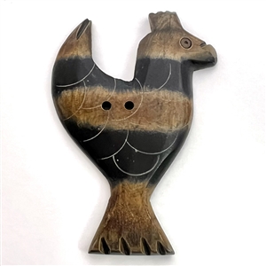 HUGE carved button of a stylized bird.